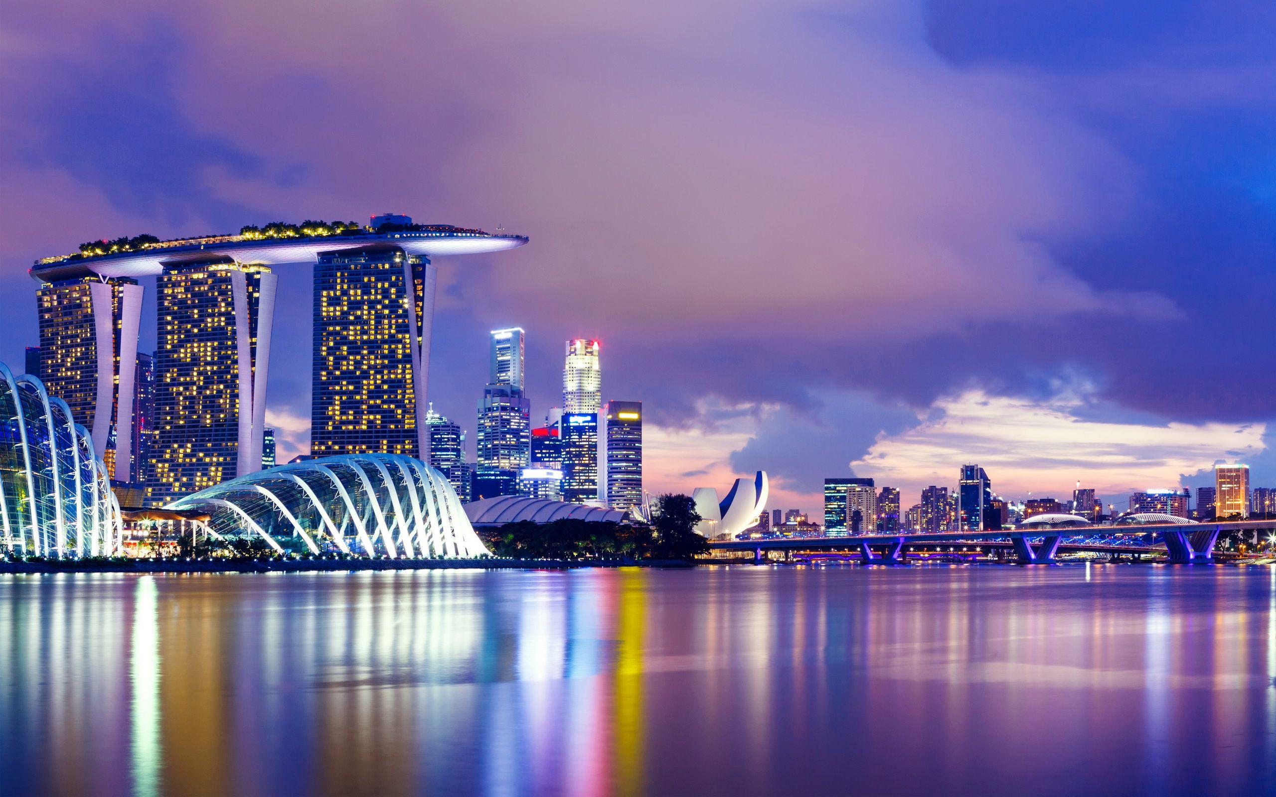 Singapore skyline at dusk with Marina Bay Sands and Gardens by the Bay